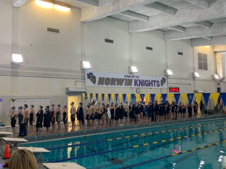 The Norwin swim team stands for the Pledge of Allegiance for their virtual meet against Hempfield on Feb. 16.