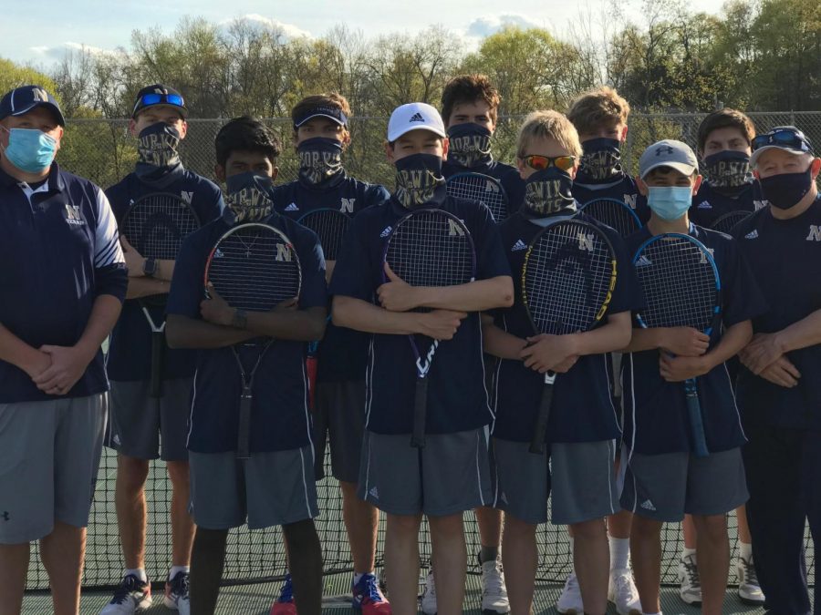 The+boys+tennis+team+poses+for+a+group+picture.+
