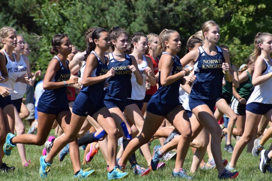 The girls cross country team races at California University.