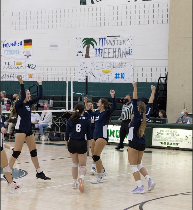 The Lady Knights celebrate in their playoff game against Pine-Richland after a kill by Natalie Miller. 