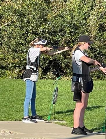 Alessia Sandala and Athena Steinbruegge set up to take a shot at a target. 