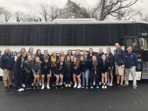 Norwin Lady Knights baksetball team lines up in front of their coach bus in Washington DC. 