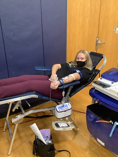 Angelina Zezza donates blood at Norwins December blood drive.