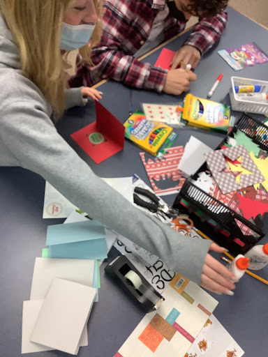 Dec. 6-8 students work on decorating Christmas cards in the library.
