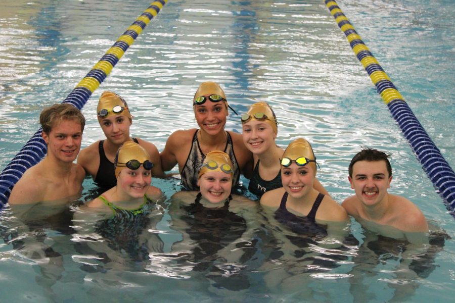 The+senior+swimmers+huddle+together+after+their+final+home+meet+against+Hempfield.