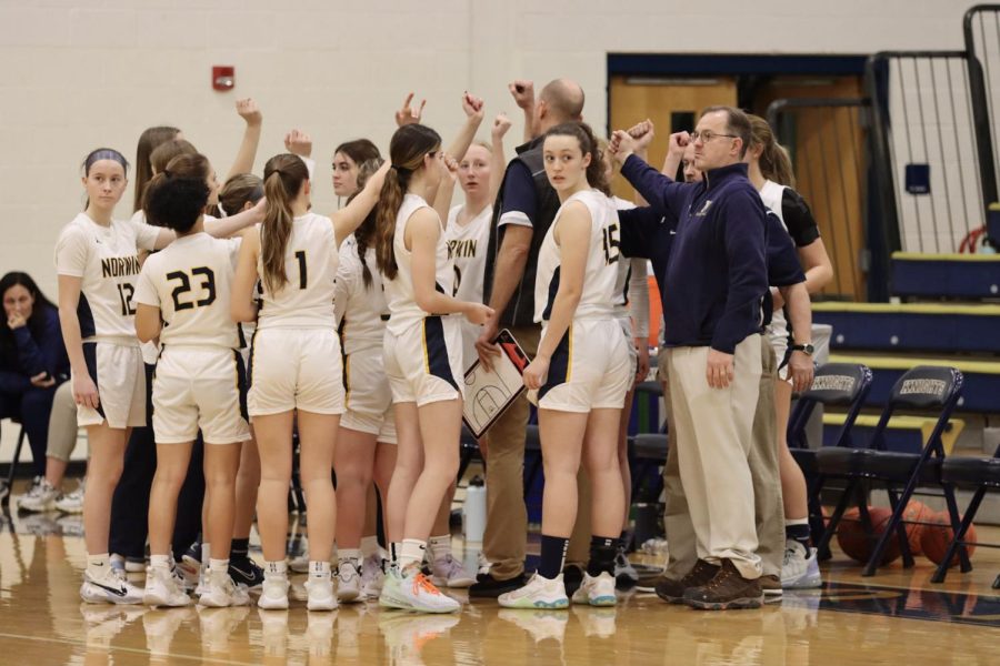 Norwin Girls Basketball ready to get back on the court after a time out. 