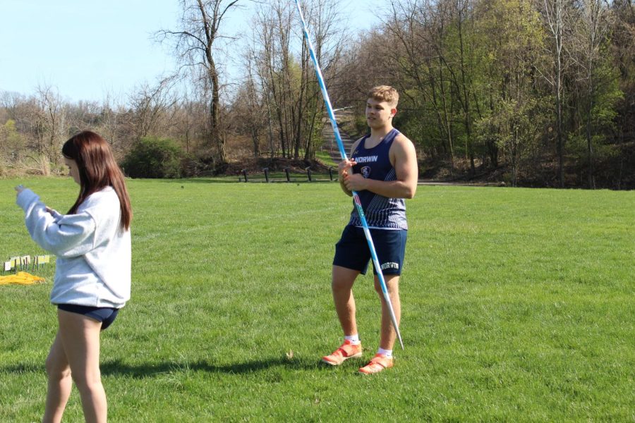 Senior Aaron Schmook prepares to throw javelin.