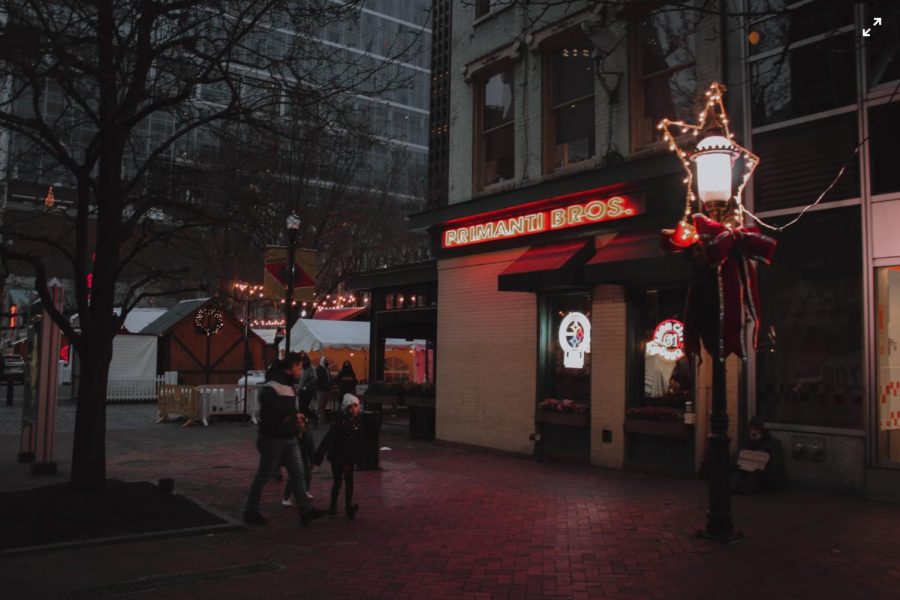 Families walk through Market Square during the holiday season. 