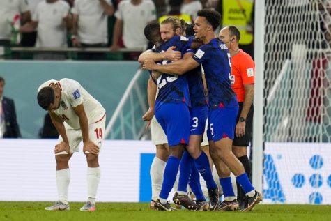 The U.S. Mens National Team embraces each other following their victory against Iran.