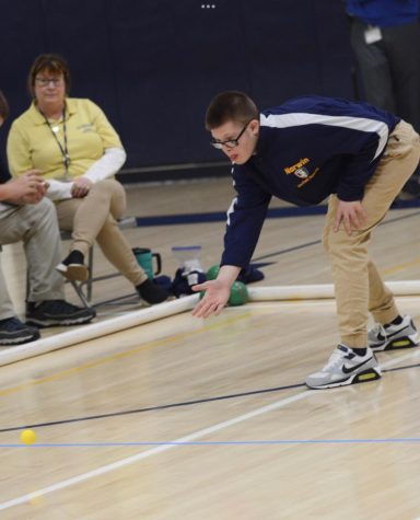 Anthony Altier roles the pallina (yellow ball) to begin the Unified Bocce match.