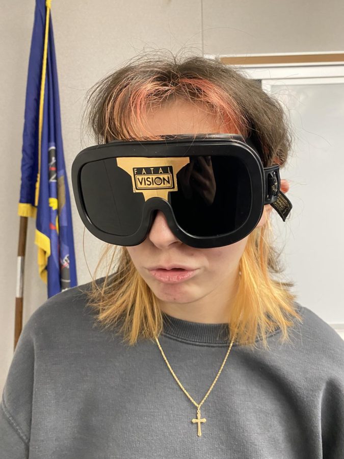 P. Tokay (11) poses for a picture with the intoxication simulating goggles on. 