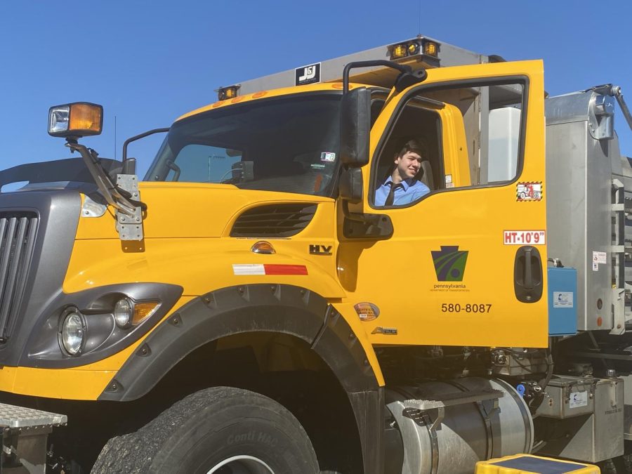 Nicholas Cormas (12) poses for a picture inside of the snow plow.