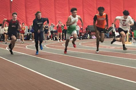 Junior Nicholas Legnine competes in the 60 meter dash at Edinboro University.