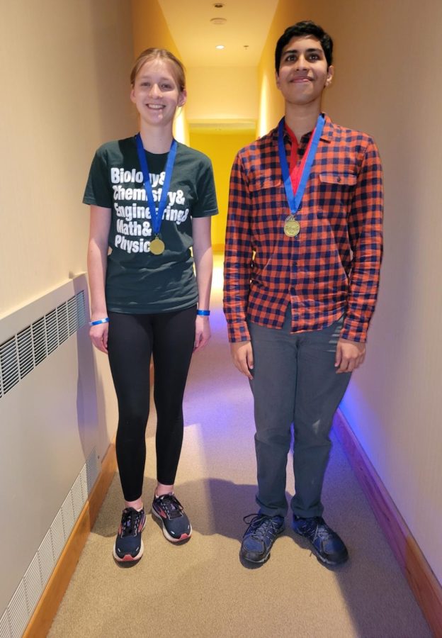 Lily Chaney (9) and Arnav Bedekar (11) pose with their first place medal in Rocks & Minerals. 