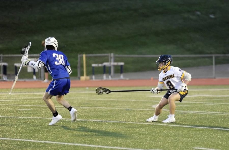 Andrew Brown fights for ball in lacrosse match