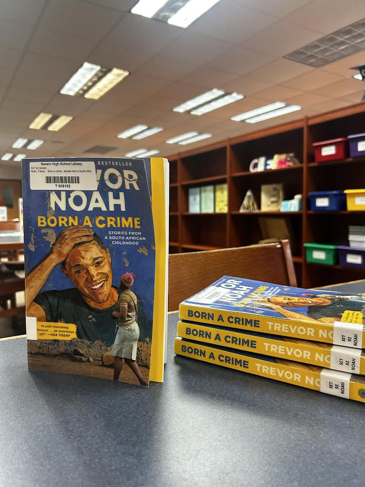 Trevor Noah’s famous novel “Born a Crime” stands up in the Norwin High School Library, for future use in the Global Literature Book Club. 