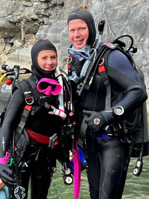 Lindsey Shuber and Mr. Shuber pose for a photo after open-water diving. 