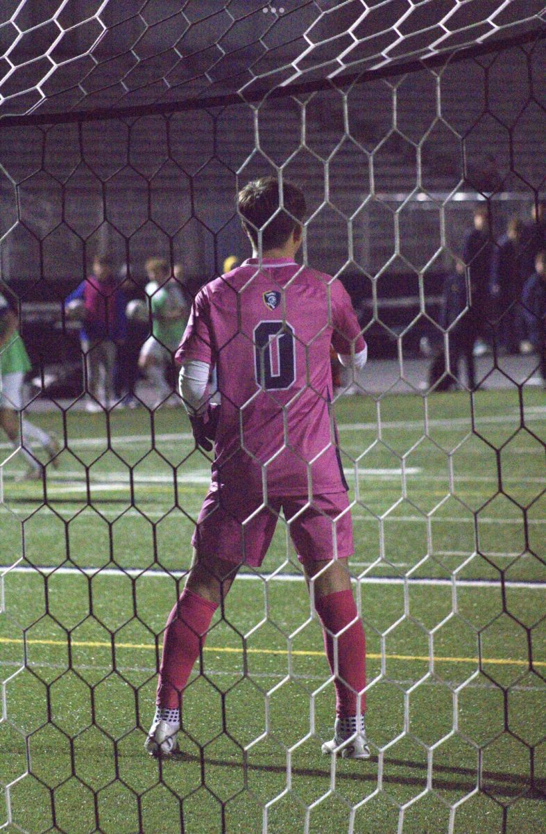 Goalkeeper Anthony Scalise watches the ball ready to make a save.