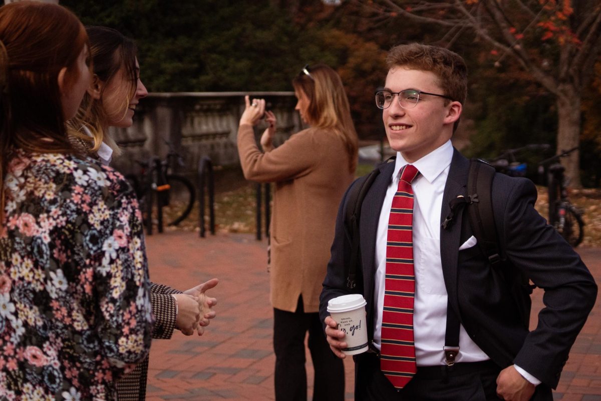 Senior Andrew Brown talks with fellow member Paige Tokay of Model United Nations Club at University of Virginia competition.