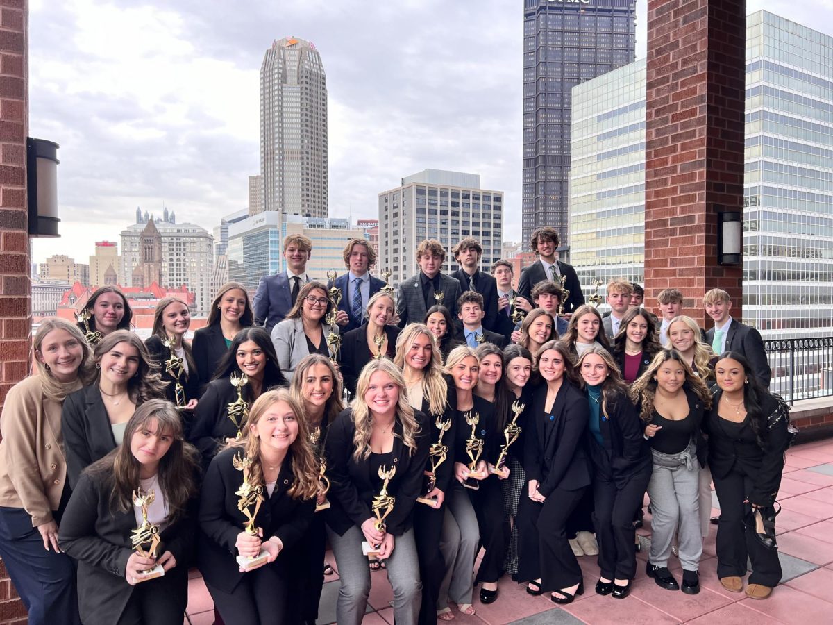 Students+of+Norwin%E2%80%99s+DECA+club+pose+for+a+group+photo+following+their+competition+at+the+Duquesne+University+Business+Center+on+Nov+29.+21+out+of+37+members+received+awards%2C+meaning+that+they+qualified+for+the+state+competition+in+Hershey+on+Feb+21.