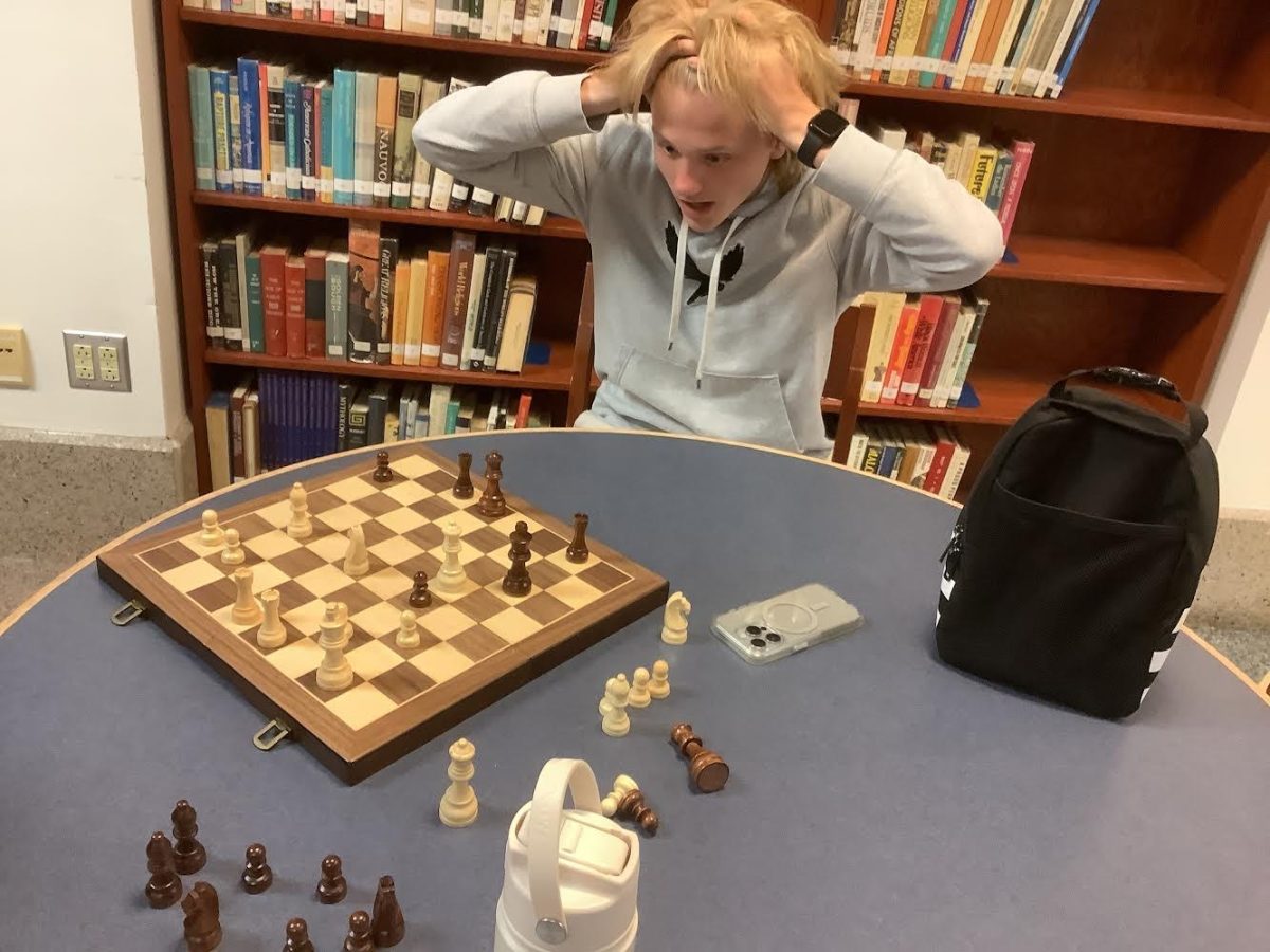 Freshman Roman Ola looks on in disbelief at a practice Chess game at Norwin High’s Chess club.