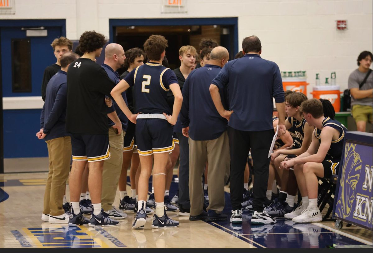 Norwin breaks first pregame huddle of the year (photographer-Richard Straw).