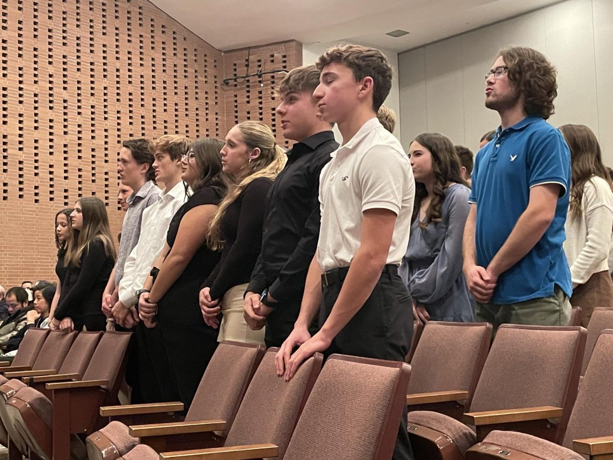 Inducted students repeat the NHS induction oath at the induction ceremony for Norwin’s branch of the NHS.