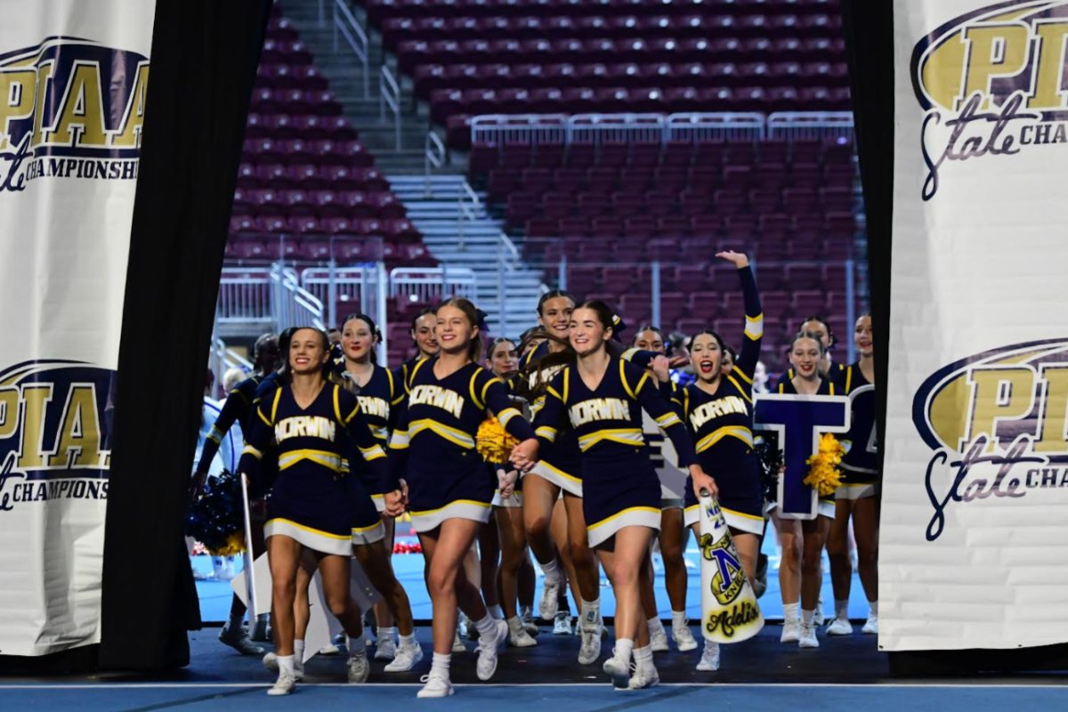 Norwin Competition cheer team entering their competition