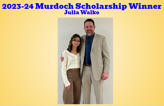 Senior Julia Walko poses with Dr. Michael Choby to congratulate her on winning the schools largest collegiate scholarship worth approximately $50,000!