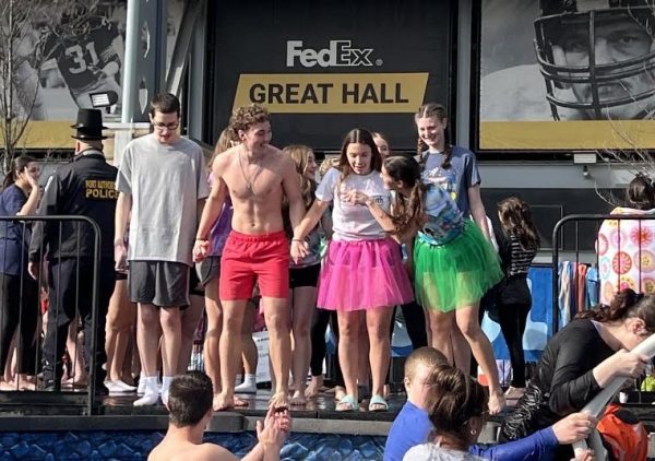 Norwin buddys and peers plunge into the freezing cold water to kick off the Pittsburgh Polar Plunge.