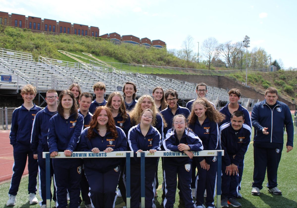 Norwin Unified Track and Field Team poses together at senior night.