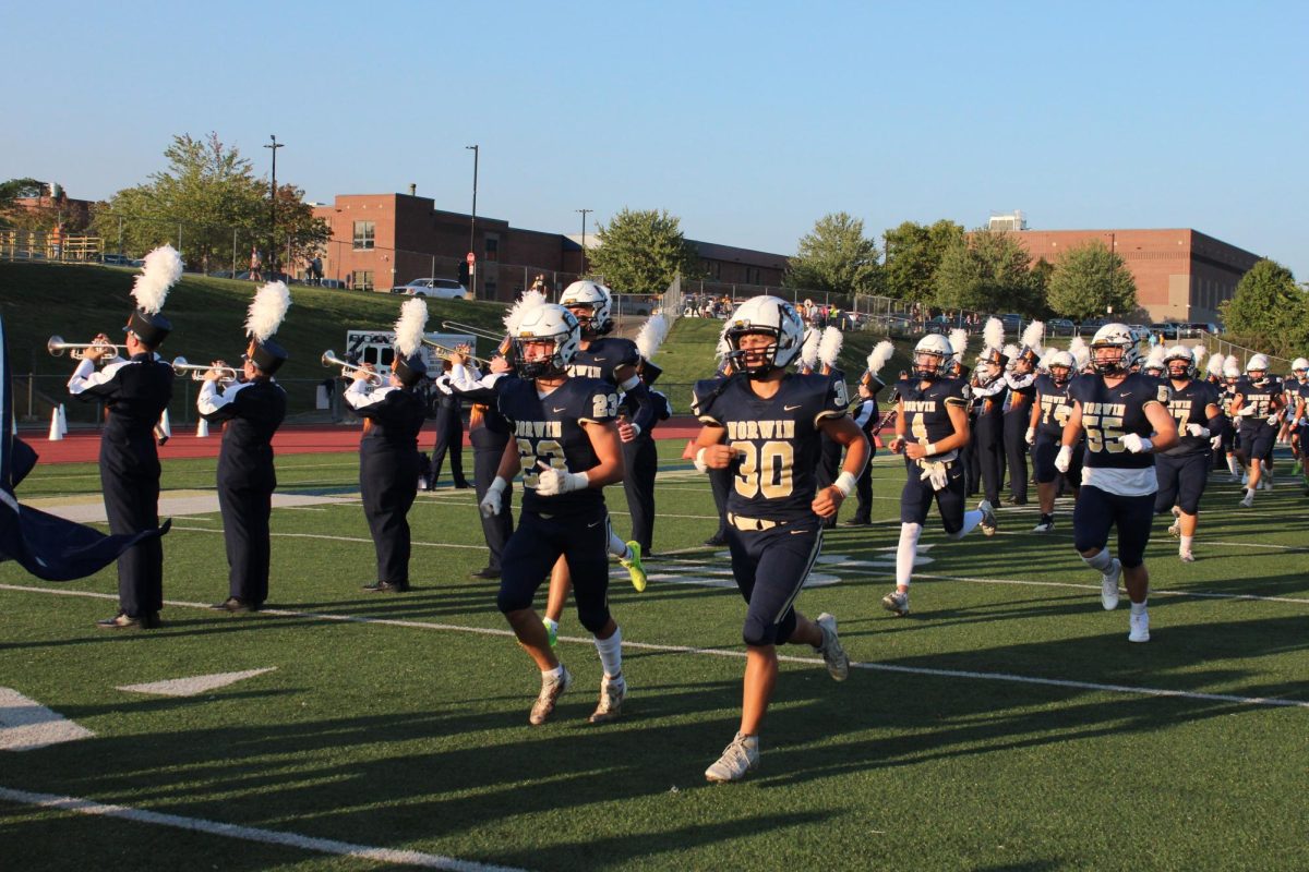 Senior running backs Jackson Huss and Jake Sincak, lead out the team in the season opener.