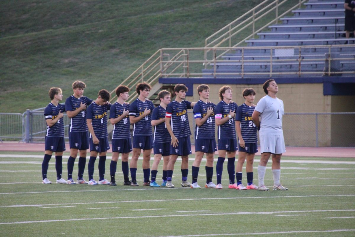 The Knights stand for the pledge before their game against Peters Twp