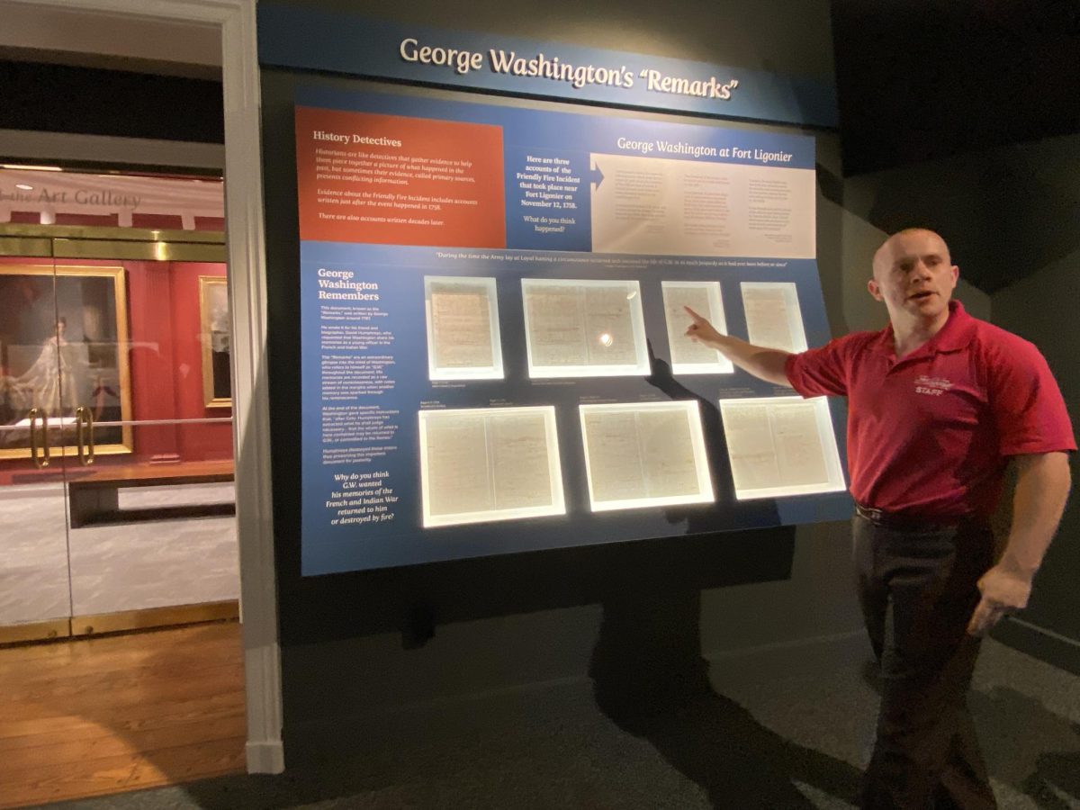 Depicted is a display case of documents written by George Washington about his experience during The French and Indian War.