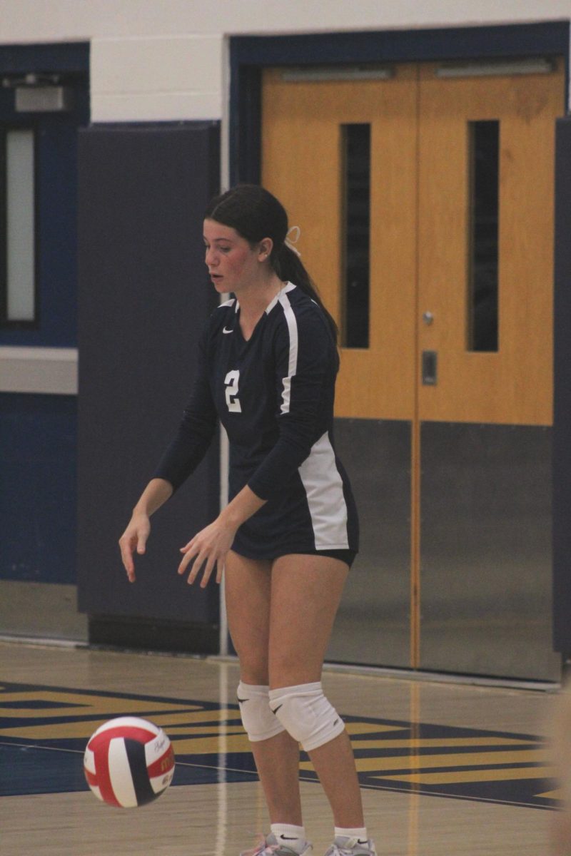 Myla McCabe prepares to serve the ball.