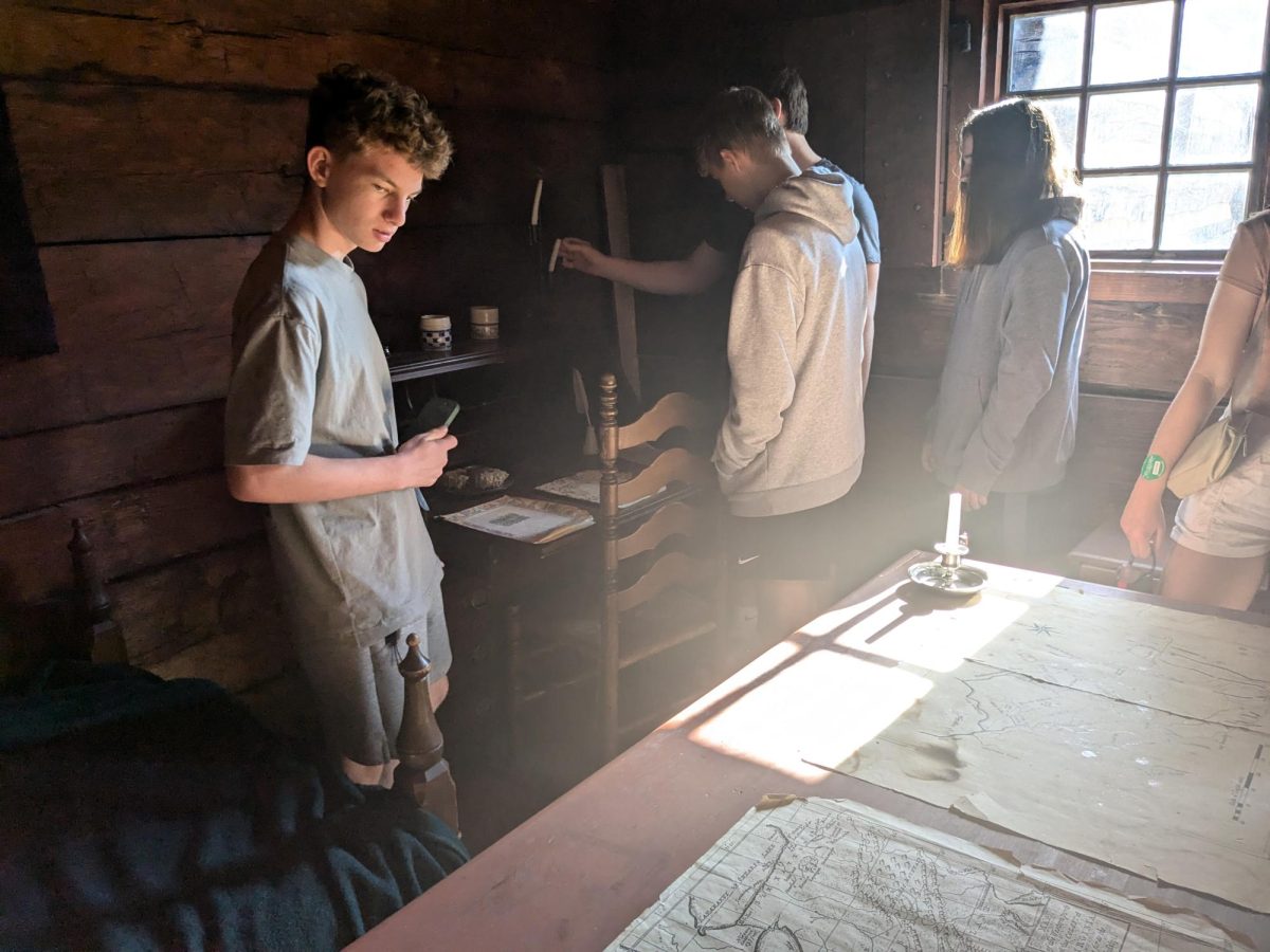 AP U.S. History students explore a recreated building and replica furnishings.