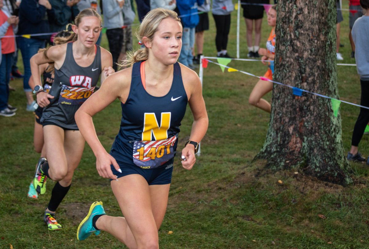 Annie Czjakowski turns the corner at the Red, White and Blue Invitational.