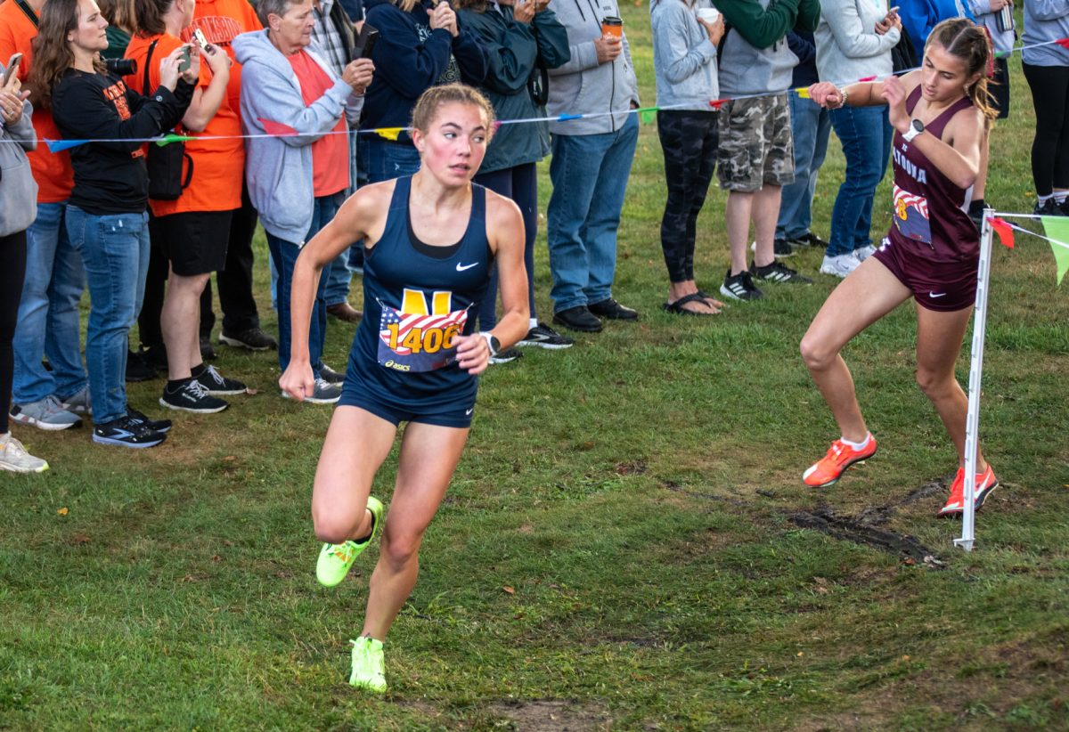 Addison Farrah turns the corner at the Red, White and Blue Invitational.