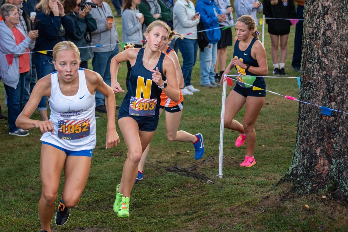 Emily Dansak turns the corner at the Red, White and Blue Invitational.