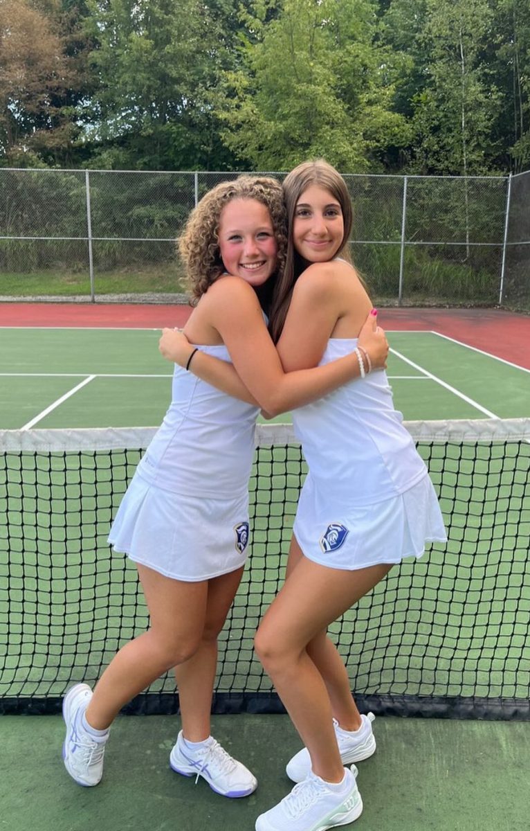 Senior Sophia Lepore and freshman Bayleigh Vilage hug each other after learning that they both qualified for the WPIAL singles tournament on September 18. 