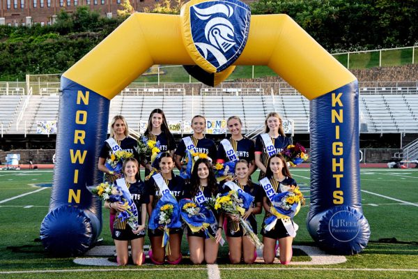 Norwin seniors pose under the arch during a game with Woodland Hills. 