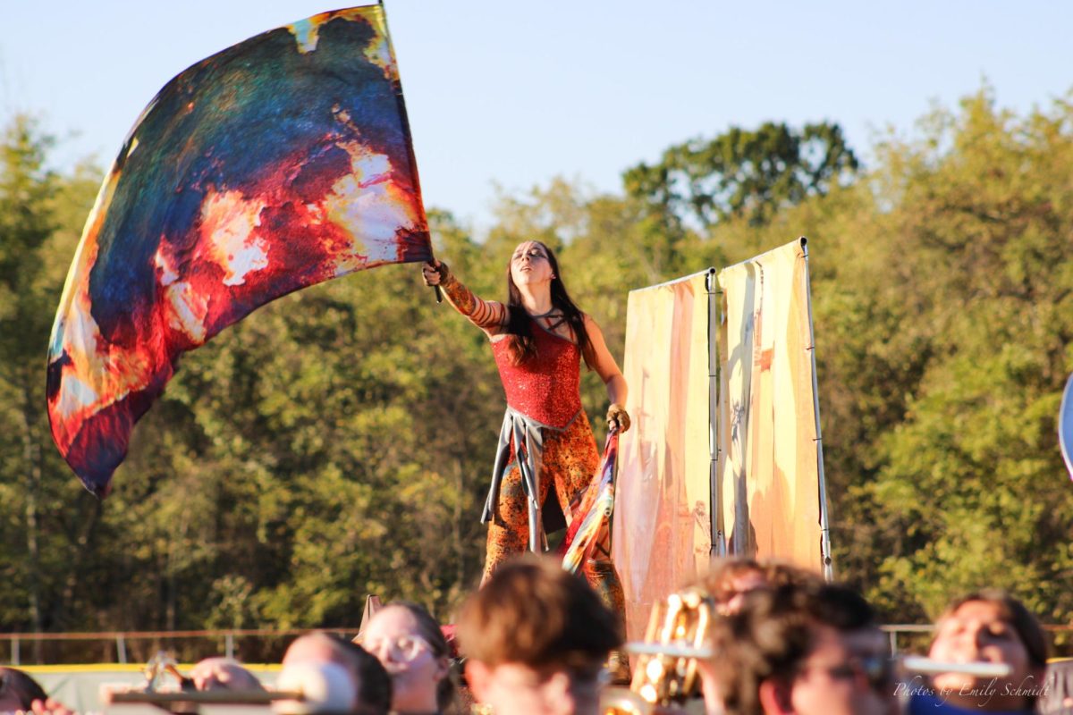 The Norwin Marching Band’s Color guard performs with big flags at the Yough Senior High school band show 