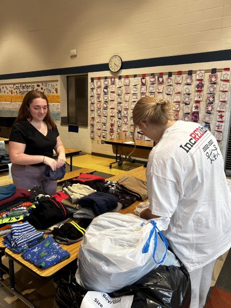 Norwin students fold boys’ clothes for the annual clothing drive the following day. 