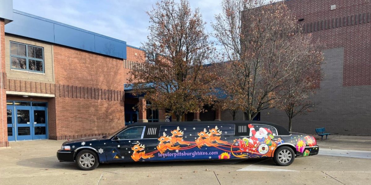 The Toys for Pittsburgh Tikes limo parked outside Norwin High School.