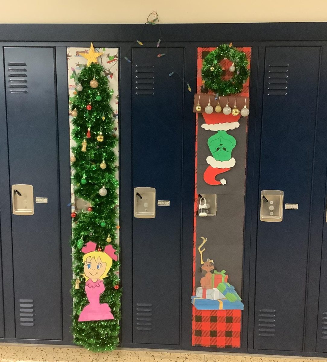 These two lockers had connected decorations with a Grinch theme. The one locker had a tree with Cindy Lou Who, and the other had the Grinch climbing down a chimney.