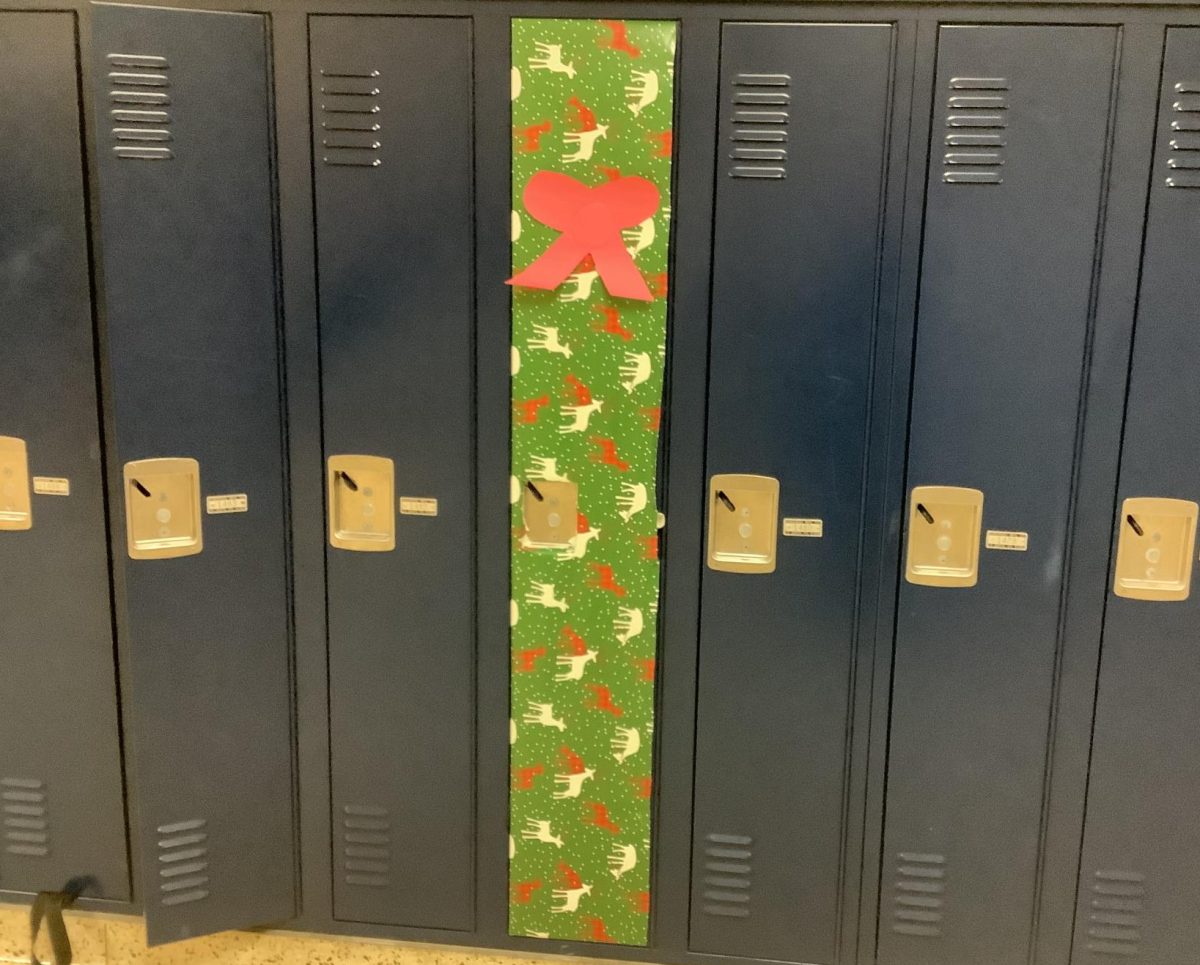 This locker was wrapped in green, red, and white wrapping paper with a bow. 