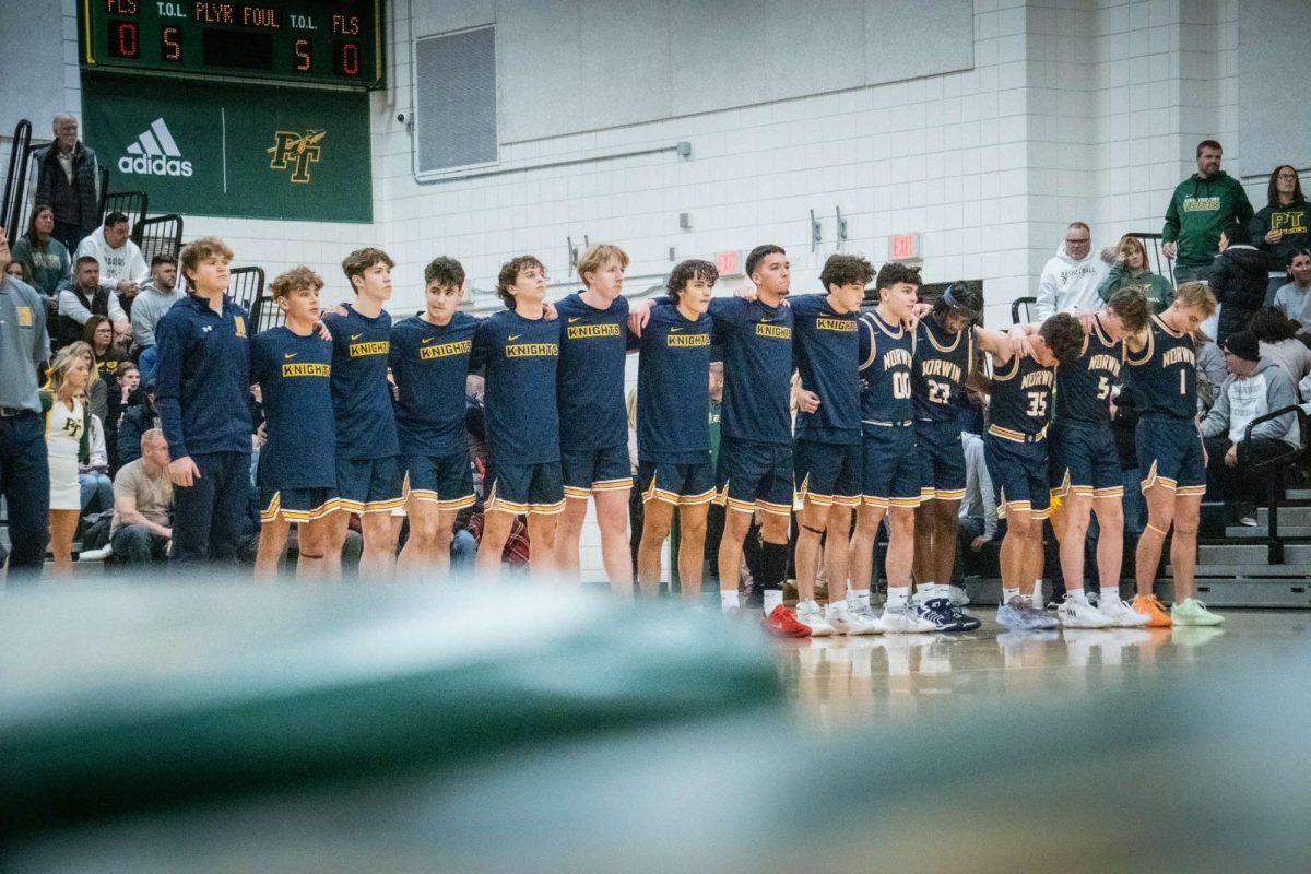 The Knights lining up for the National Anthem before the season opener against Penn Trafford.  (Photo-David Dziedzic-@ddproductions26)