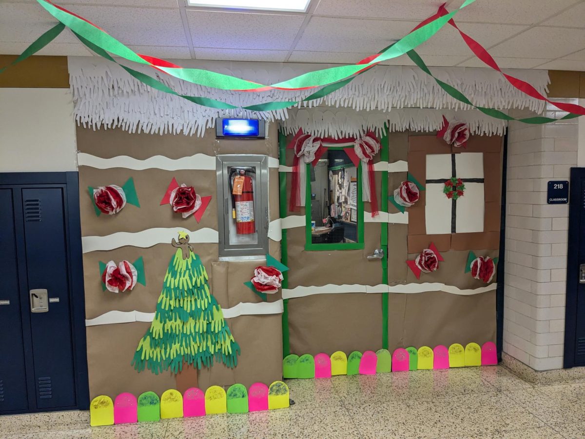 Room 218 had a gingerbread house theme. The main colors were white and brown with a decent amount of green. Other accent colors were red, pink, and yellow. 