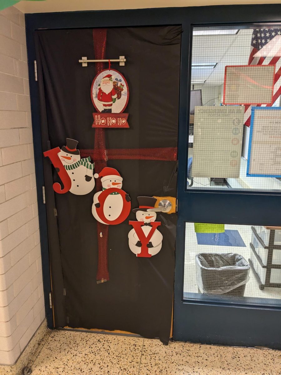 This door had a snowman theme with the main colors of white, red, and black. 