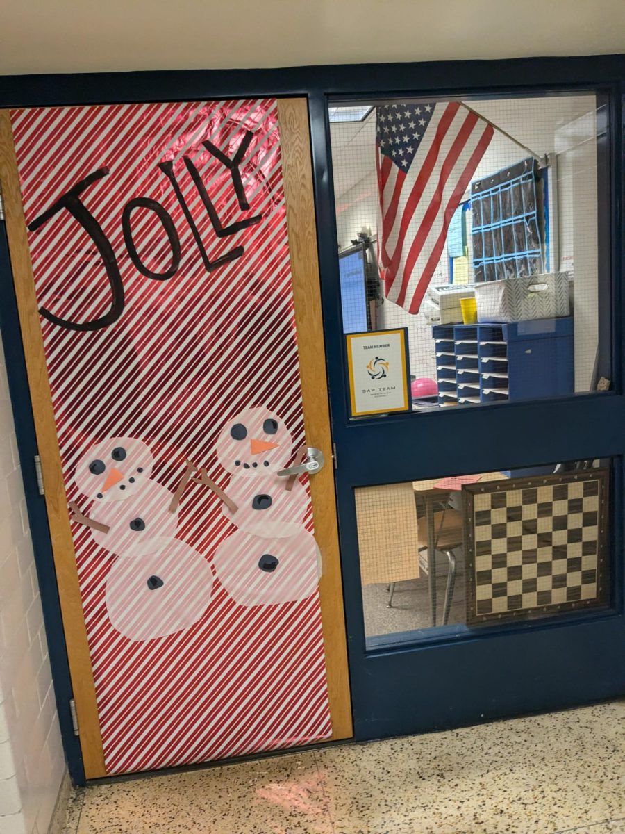 This door had a snowman theme with the main colors being red, white, and black